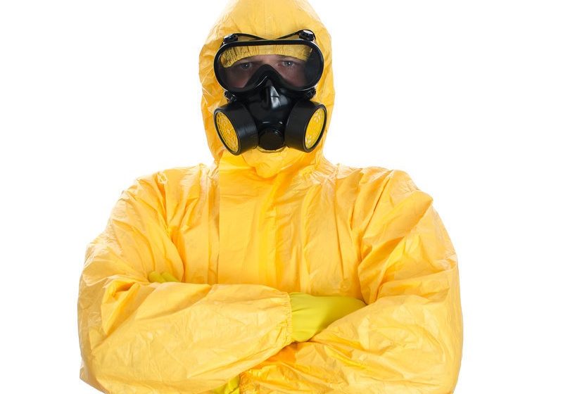 Man in protective hazmat suit. Isolated on white.